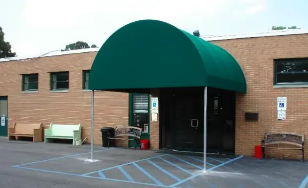 Barrel and slope-style stationary awning on a South Jersey porch — All Seasons Awnings