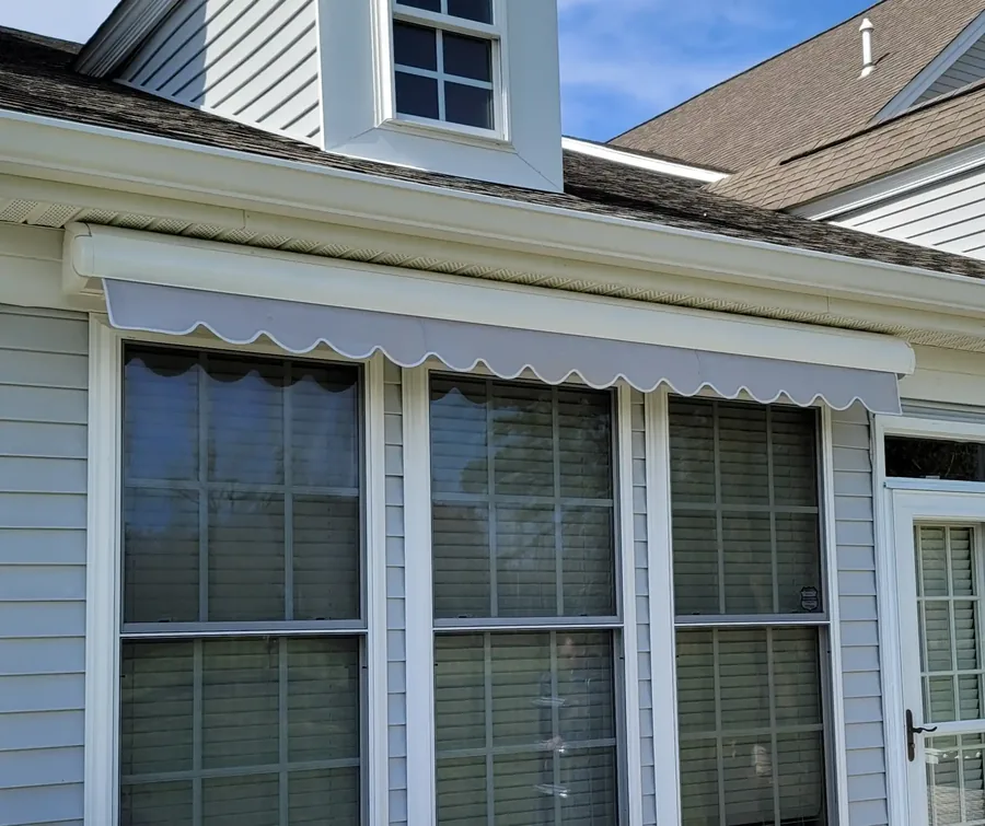 Retractable awning over windows at a South Jersey home — All Seasons Awnings