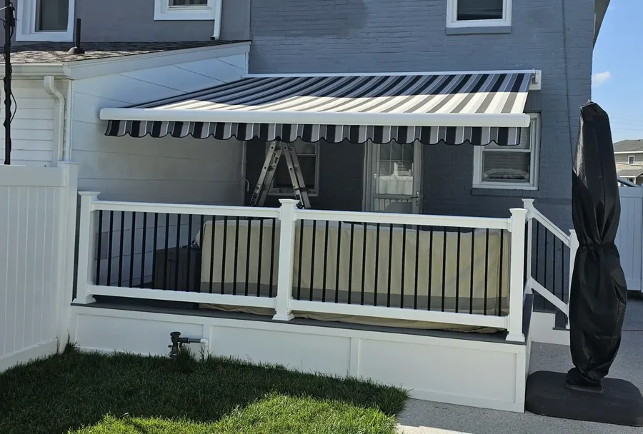 Blue and white striped retractable awning — All Seasons Awnings, South Jersey